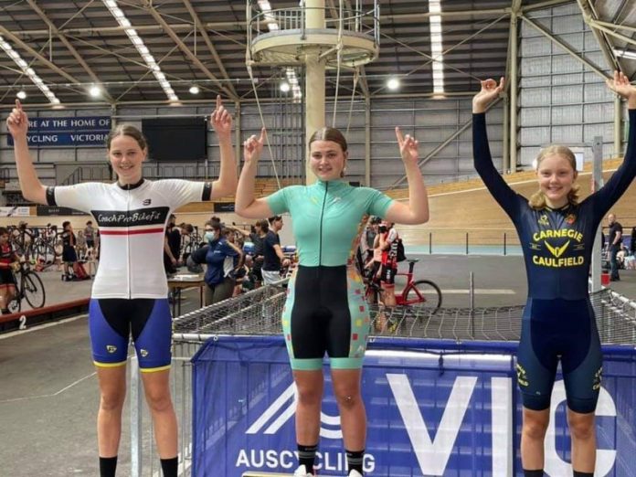 Leshae Maddern (centre) on the podium.