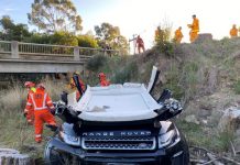 Range rover plunges into Forest Crk
