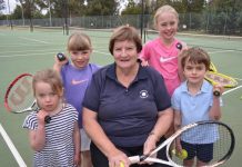 End of an era Local tennis coach Jill Atkin is proudly pictured with her grandchildren Winnie, Vivienne, Willow and Sandy.