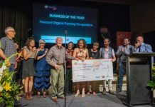 Organic farming co-op gets top biz gong Merv Carr, daughter Katie Finlay and the elated team from Harcourt Organic Farming Co-Operative are proudly pictured receiving the 'Business of the Year' award last Thursday evening.