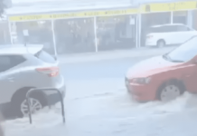 VIDEO: Crazy flash flood inundates footpath on Barker Street