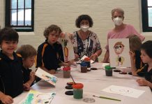 Guildford Primary School celebrates! Campbells Creek/Guildford Primary principal and students are pictured with Bendigo West MP Maree Edwards on Monday.