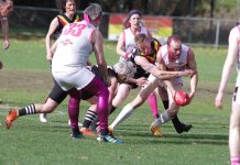 MAIN Game fundraiser kicks goals The Rockatoos and Radio Galahs vie for the ball at the Camp Reserve on Sunday. Photo: Max Lesser.