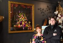 Castlemaine Floristry join forces with local arts on new work Artist Lauren Starr and Castlemaine Floristry's Patrick Grant are pictured with the magnificent work 'Abundance-memento vivere'.
