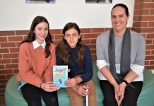Author inspired by Jarrah and Mathilde’s friendship Castlemaine teens Mathilde Cross and Jarrah Podesta and award winning author Pip Harry are pictured with her new book August & Jones on Monday.