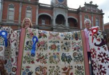 Goldfields Quilters celebrate success in Victorian Quilters Showcase Elli Henry and Pattie Ritchie are pictured with their award winning quilts and the raffle quilt (centre).