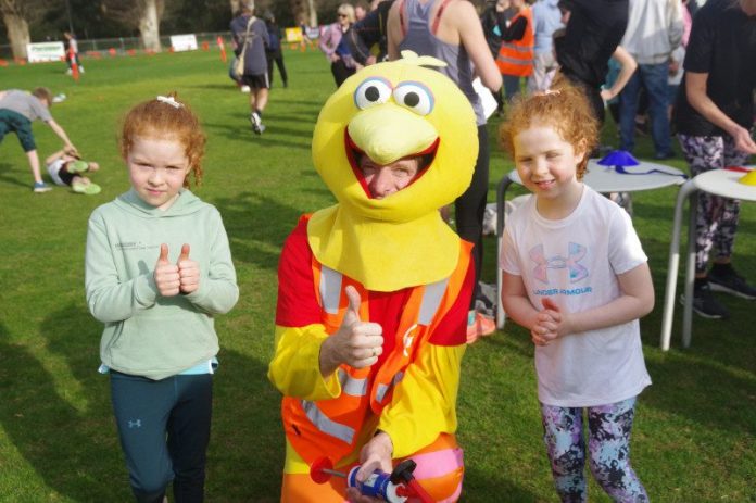 Twins Molly and Annie enjoy a photo op with Run The Maine mascot 'The Bird'. Photo: Max Lesser.