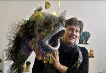 Community prepares to celebrate 30 years of Fringe Castlemaine artist Diane Thompson with a fish mask used in the 'Walking the Fish' street parade in the 1992 Fringe Festival.