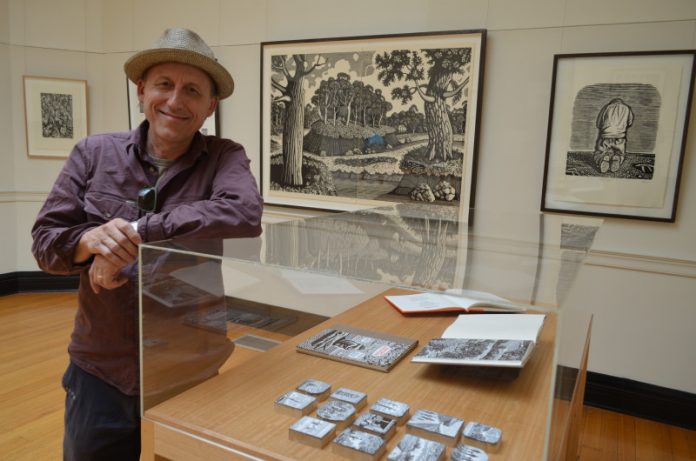 Local printmaker David Frazer is pictured with some of his works featured in 'For the Love of Song'.