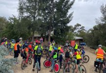 Changing lives with bicycles The group prepare for their ride to the Castlemaine Botanical Gardens.