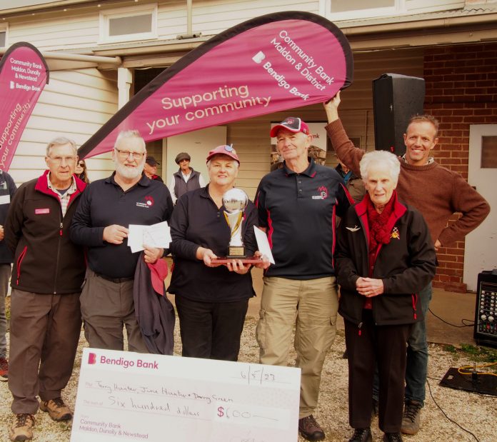 George Forster (left) and Janet Forster (right) are pictured with the winners of the Forster Cup from Mt Macedon.