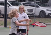 Tennis players combat the rain