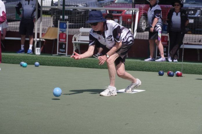Castlemaine bowler Rod Fletcher is pictured in action on Saturday. Photo: Max Lesser.