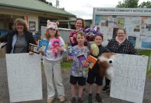 Elphinstone residents Sam, Romy, Susan, Gilbert, Ren and Nikki invite the wider community to attend Sunday's Elphinstone Town-Wide Garage Sale and grab a bargain.