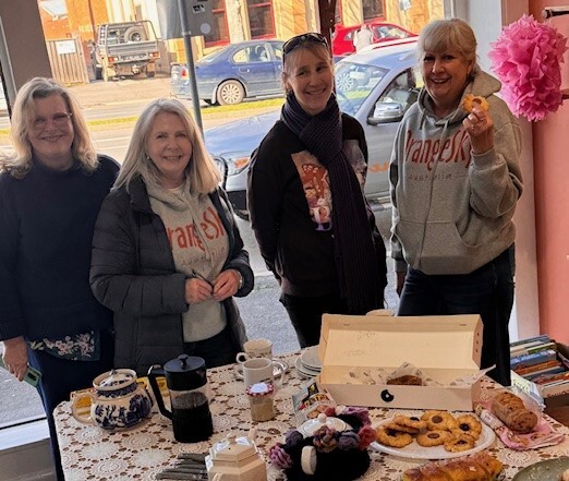 cOrangeSky141125-web Volunteers from Orange Sky celebrate the third anniversary of the service at Sac'O'Suds.