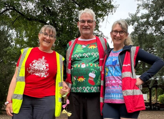 Volunteers Robyn, Peter and Pam in festive form.