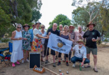 The Chewton Bocce Club are proudly pictured with their flag. Photo: John Ellis, Chewton Chat.