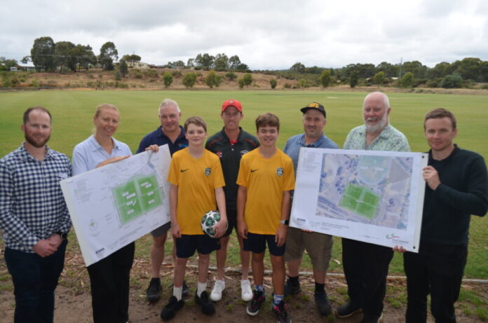 Council staff members Troy Lyons and Karen Evenett, Wesley Hill Recreation Reserve Commitee of Management chair Ken Maddern, North Castlemaine Cricket Club president John Howarth, Castlemaine Goldfields Football Club members Edan Lacy, Lochie Coombes and vice president Hannes McNamara, Cr Phillip Walker, and council team member Jordan Maw are pictured with the concept plans at Monday's community consultation session.