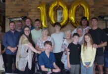 Centenarian Joyce Perry (centre right) is pictured with her family members Rhonda, Rachael, Daniel, Damian, Nova, Elise, Justin, Tricia, Cai, Tom, Eddie, Marilyn, Simon, Olive, Martin and Lawrie. Photos: Max Lesser.