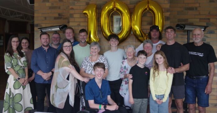 Centenarian Joyce Perry (centre right) is pictured with her family members Rhonda, Rachael, Daniel, Damian, Nova, Elise, Justin, Tricia, Cai, Tom, Eddie, Marilyn, Simon, Olive, Martin and Lawrie. Photos: Max Lesser.