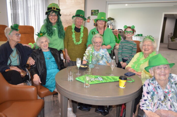 Arcare residents are pictured in their Irish flair for the St Patrick's Day event with team members Amanda and Marianne and visitor Milly.
