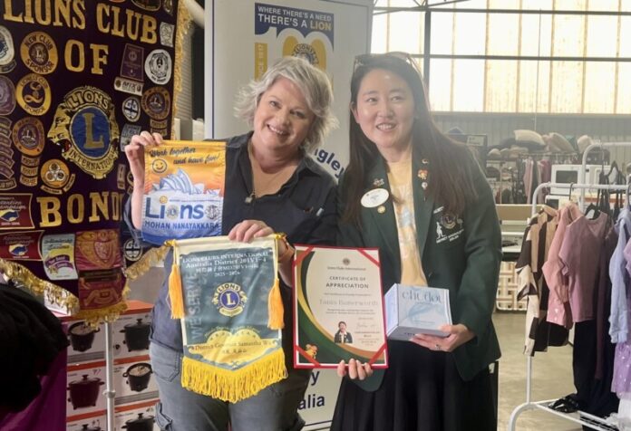 cdistributioncentre-Web Tania Butterworth receives a certificate of appreciation from Lions Club District Governor Samantha Wu.