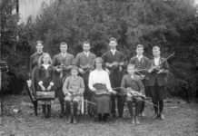 Renowned local music teacher Miss Rose McDonald with her nine successful students following the 1914 London College of Music violin exams.