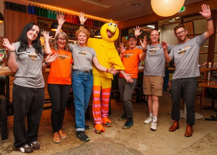 The Run the Maine committee celebrate the launch of the 2026 event at Boomtown Winery & Bistro.