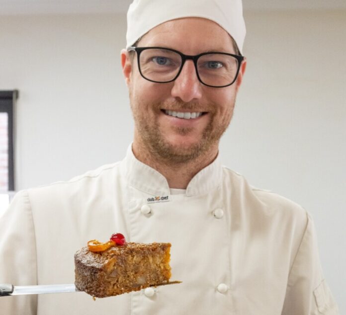 Johnny Baker, Castlemaine – Josh with their Ginger Carrot and Pineapple Cake. Tiffany Warner Photography.