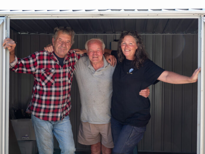 Lance Bell, Tom Taft, and Debra Tranter in Tom's newly erected shed.
