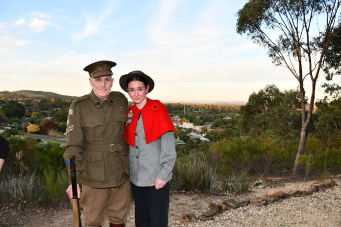 Bill Bates fired four blanks to commemorate the occasion at Maldon. Bill and his daughter Isabella have been attending the ceremony in full costume for the past 10 years. Photo: Jade Jungwirth.