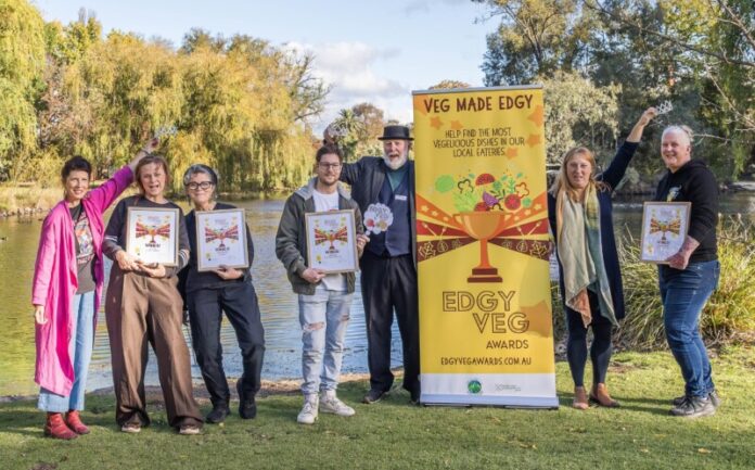 Macedon Ranges Sustainability Group Veg Action team member Fiona Songbird helps crown the cafe winners Emily Jennings from Saffs Cafe and Elissa Wilsher from Togs Place Cafe, bakery winner Josh Bendeich from Johnny Baker and Councillor Phillip Walker, Simone Hoopell from Healthy Loddon Campaspe and restaurant winner Bec Murphy from Shedshaker Brewing. See page 4. Photo: Tiffany Warner Photography.
