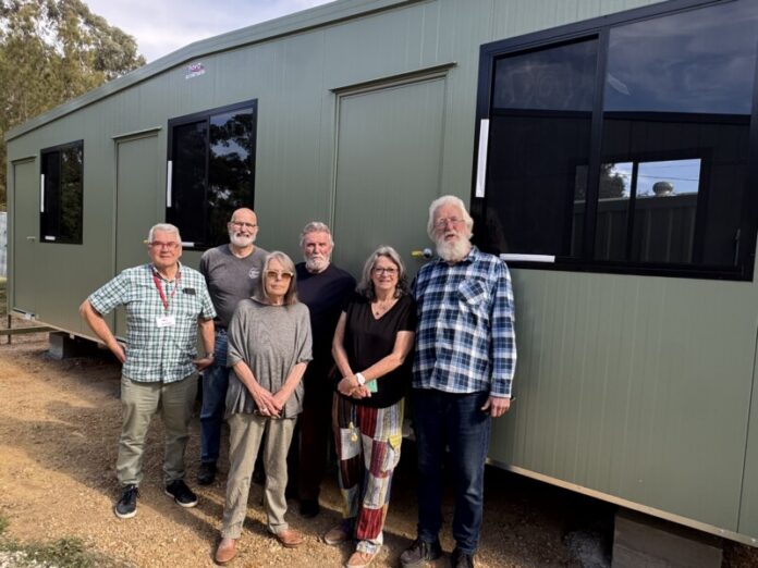 MAAW committee members Clive Allen, Ian Lihou, Glenda Mann, Steve Mann, Shirley Hardy-Rix, and Grant Roff are pictured with the new building.