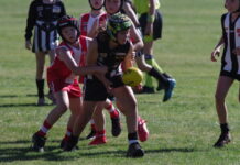 Huxley Hardman works to shake off his South Bendigo opponent. Photo: Max Lesser.