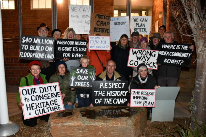 A group of protestors concerned about preserving the historical significance of the reserve called Gold Camp Castlemaine, was waiting out front with placards.
