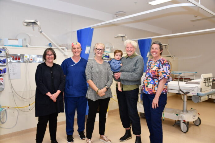 Dhelkaya CEO Sue Race, nurse Peta Ballinger, MP Maree Edwards, board director Dr Heather Margaret Holst (with grandchild) and staff member Janine McCarthy.