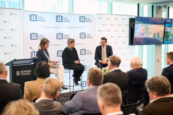 Thom Woodroofe with Christiana Figueres, the former UN climate chief and Kevin Rudd and Malcolm Turnbull (on screen) during the Melbourne launch of his book.