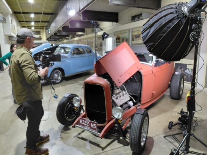 Miles and Claire from the Ideas Agency film local hot rods at Autoplex last week.