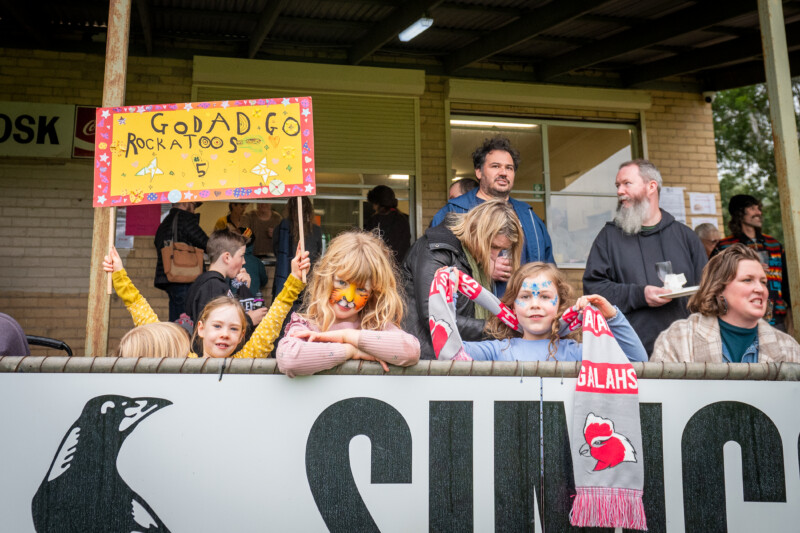Young supporters are proudly pictured in their footy colours.