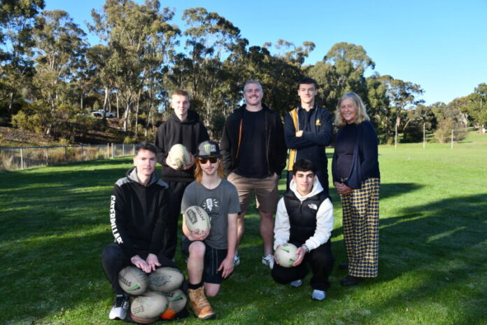 MCV Executive Director James Sorahan, Melbourne Storm player Josh King and CSC teacher Kristina Tulen-Pattison, with a few of the Year 11 VM students.