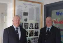 John and Bill Sikora are pictured with the donated frame which celebrates the history of the school.