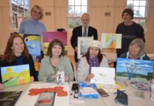 Agitation Hill Artists unveil new work Some of the Agitation Hill Artists members Julie, Irma, Mandy, Chris, Suki, Gary and Catherine prepare for their July exhibition.