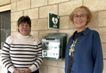 Lifesaving equipment for Campbells Creek Sue Buckman from Defib for Life and Tonye Segbedzi from Neates Road Neighbourhood News, standing next to the new AED at Campbells Creek Community Centre.