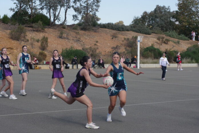 cCDNA210826-1(MainAction) Pip Sheedy and Mia Rhoda are pictured action against Raywood. Photo: Max Lesser.
