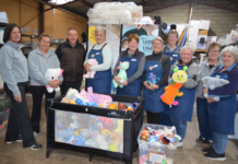 Spreading a little bit of Sunshine Some of the happy Sunshine Bendigo volunteers in their warehouse with some of the donated goods.