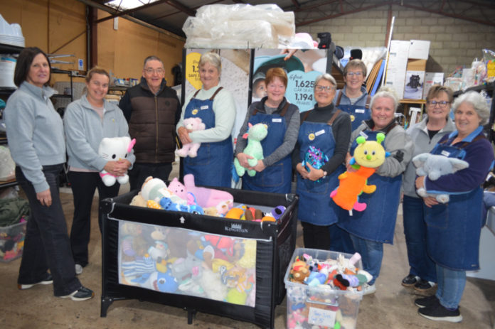cDon-Sunshine140826-1 Some of the happy Sunshine Bendigo volunteers in their warehouse with some of the donated goods.