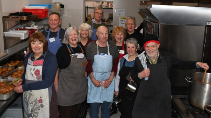 clunch210826 Carol (second from the left) with some of the volunteers preparing a Mexican feast on Tuesday.