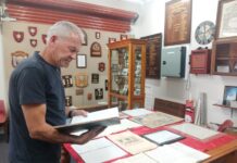Proud history of protecting our community erry Franklin (Castlemaine Fire Brigade Captain 2013-2025) shows one of the many Fire Books in the museum. Picture: Supplied