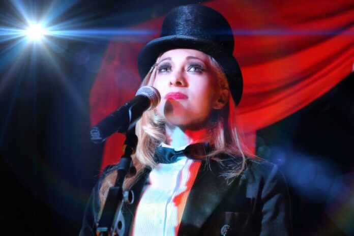 Nikki Nouveau delivers the Piaf story through song and story in both French and English. Photo: Len Panecki.